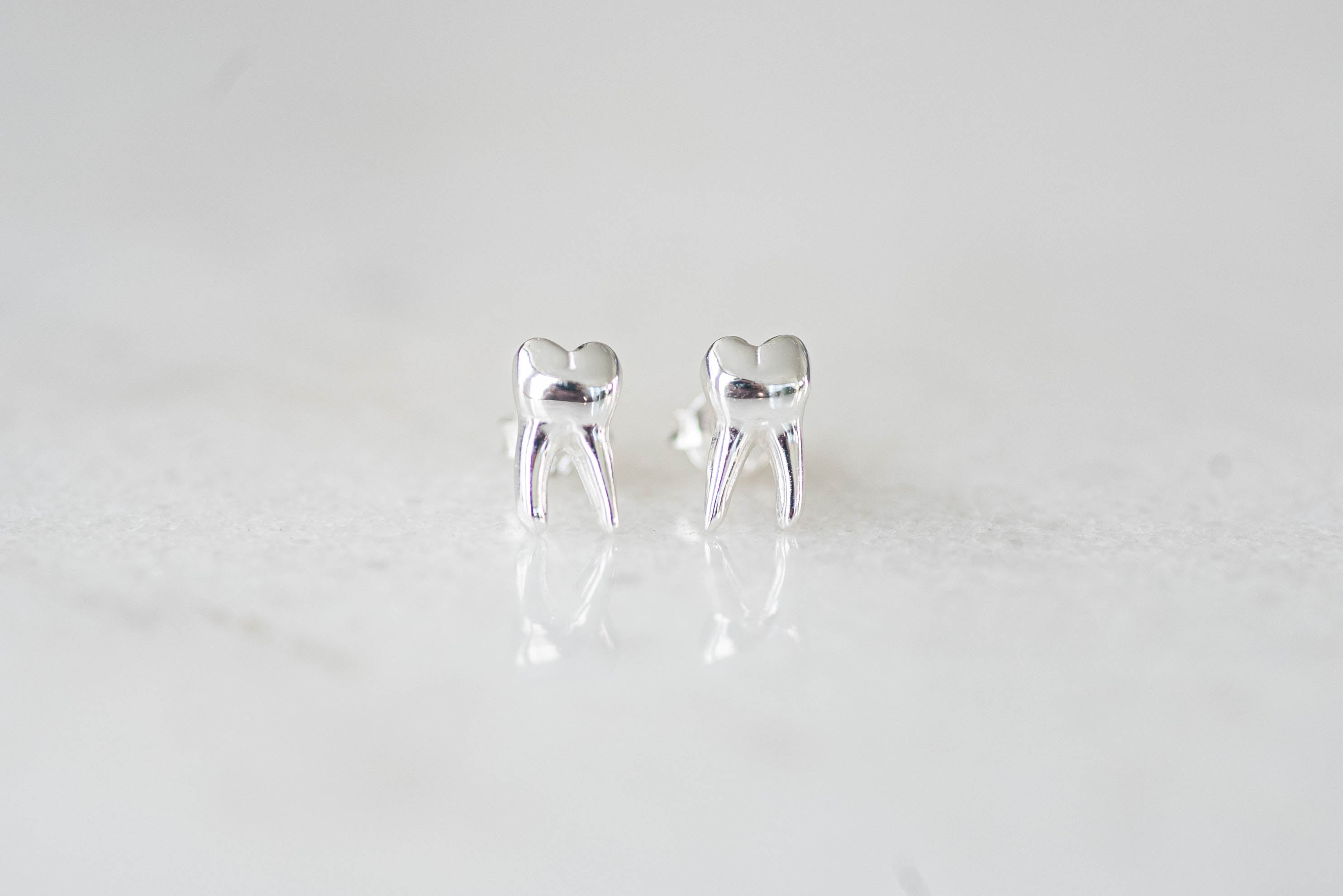 Tooth hot sale earrings studs